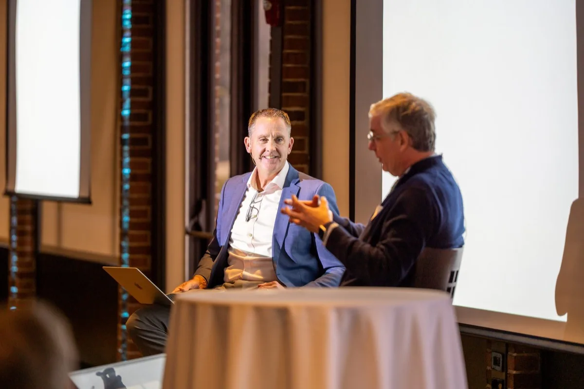 A conversation on stage at an Investor Coaching Series event